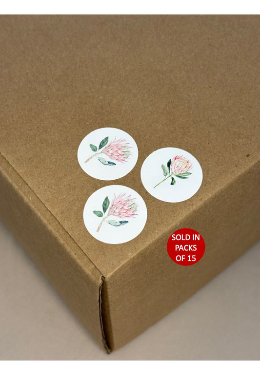 Floral stickers on a cardboard box with a 'sold in packs of 15' label.