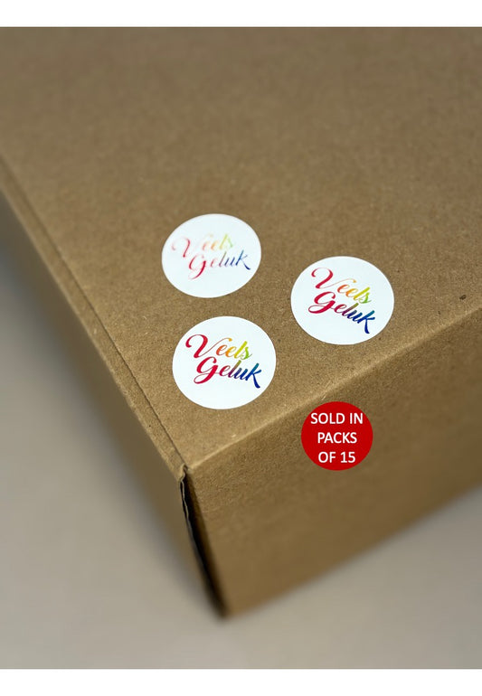 Brown box with white stickers featuring colorful text and a red label indicating packs of 15.