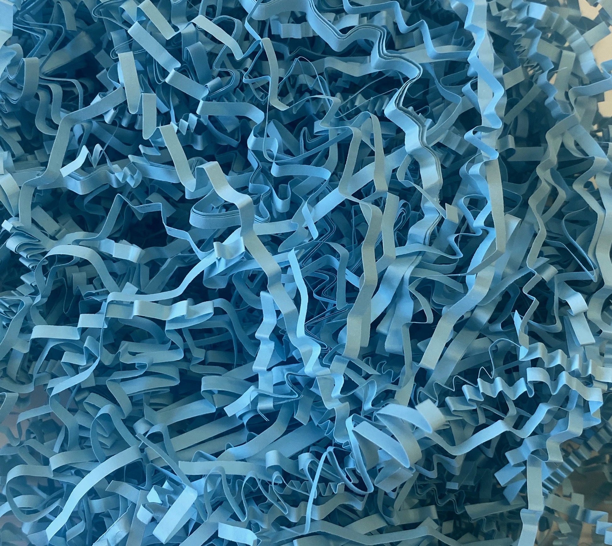 Light blue crinkle shredded paper box filler 100 gram packet
