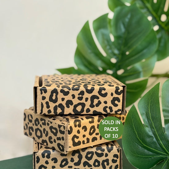 Leopard print boxes with a green leaf background