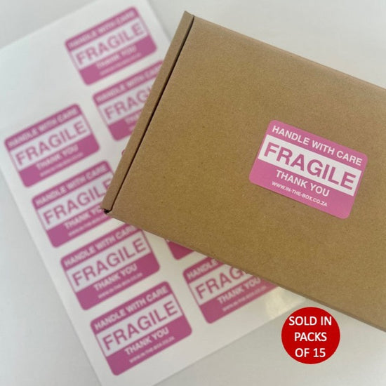 Pink fragile stickers for shipper and mailing boxes or packages