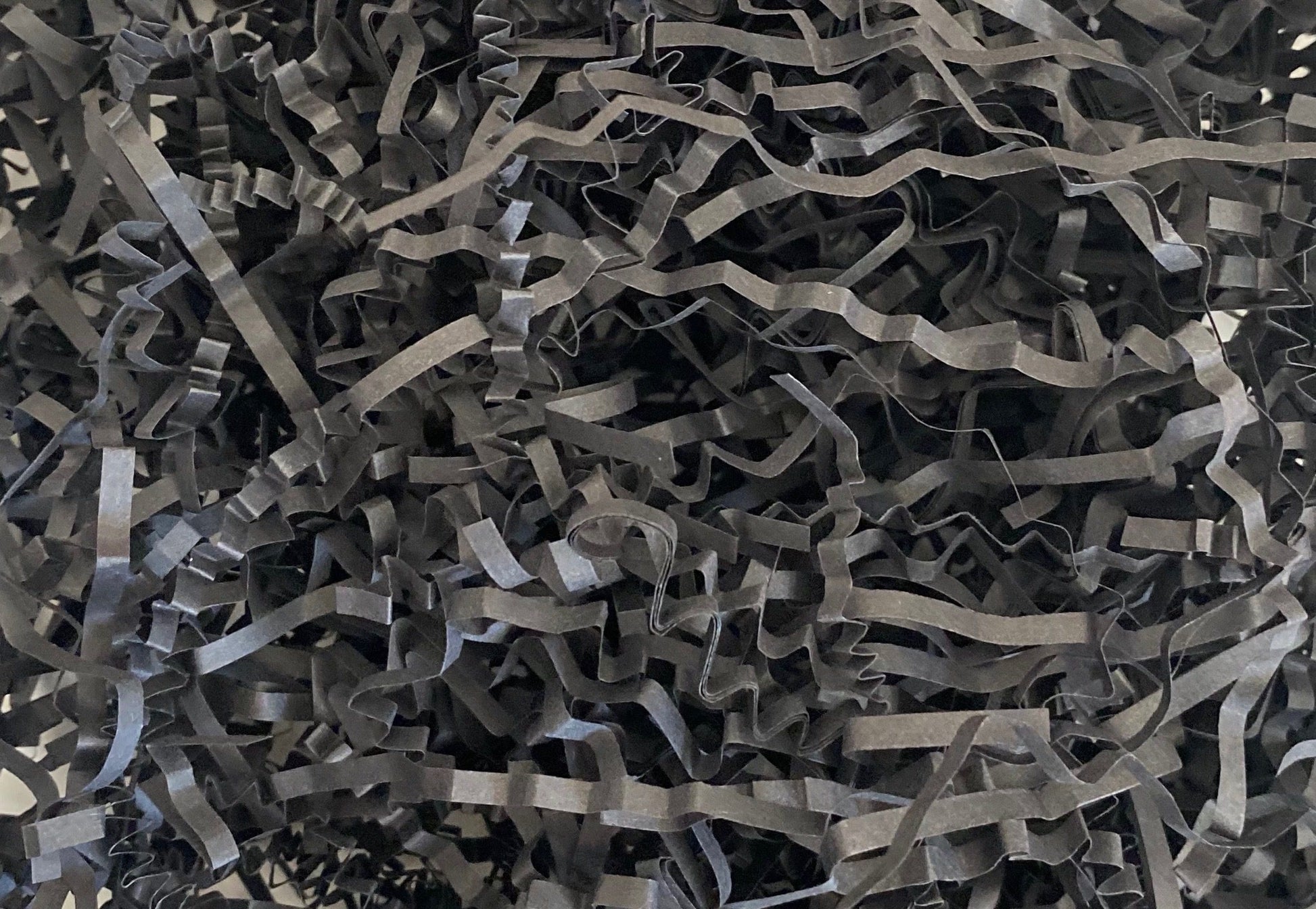 Black crinkle shredded paper box filler 100 gram packet