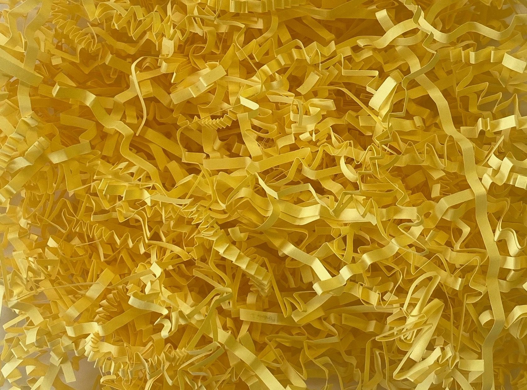 Yellow crinkle shredded paper box filler 100 gram packet